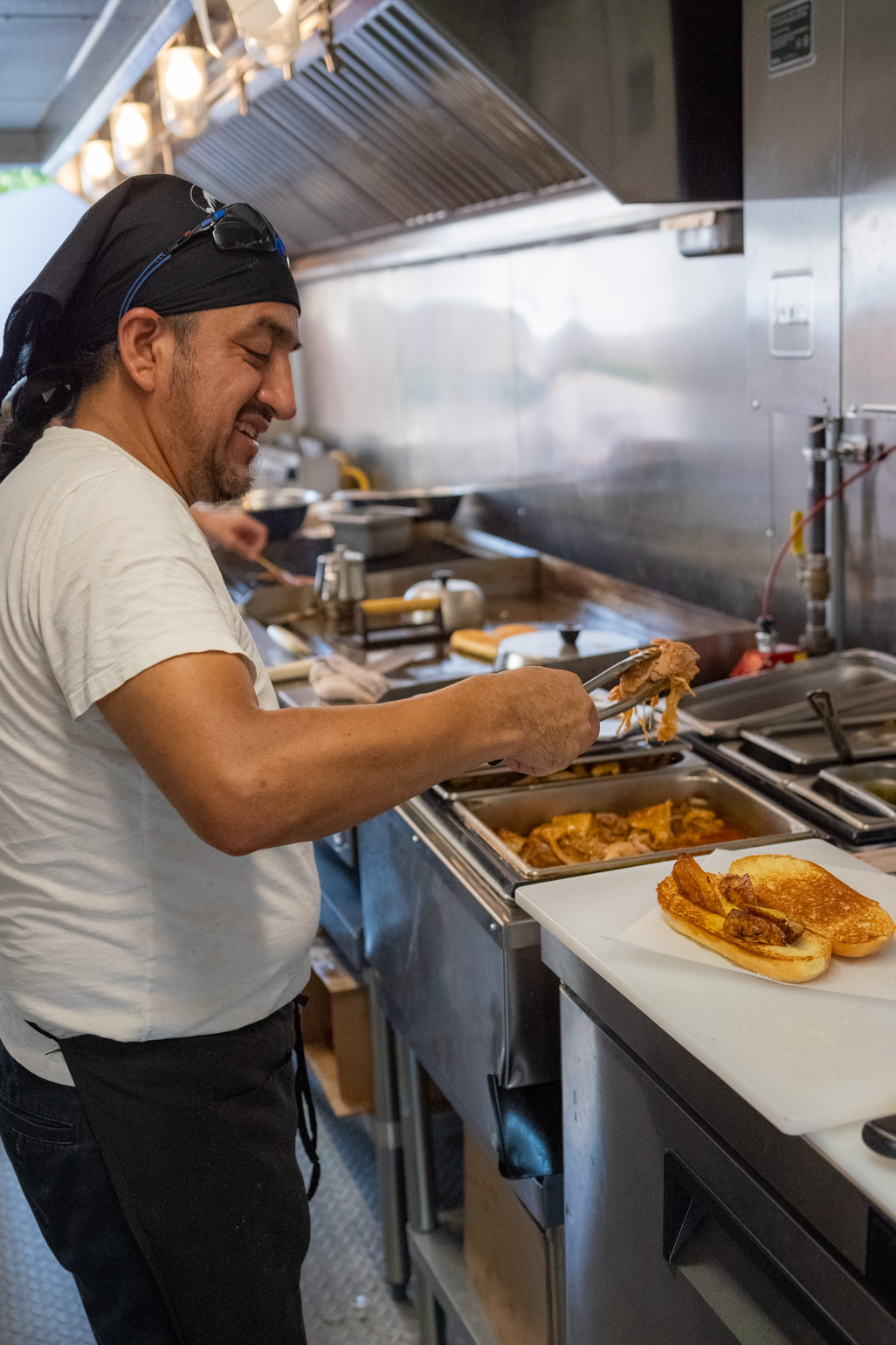 Chef Marcos preparing sandwiches